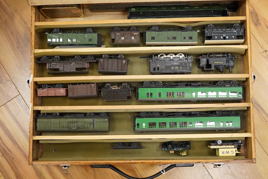 130 items of EM gauge model railway rolling stock contained within three handmade fitted wooden cases, two with removable trays, comprising three locomotives; an SR class 700 0-6-0 tender locomotive, 693, an SR 0-4-0T, 7